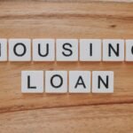 housing loan blocks on brown wooden surface